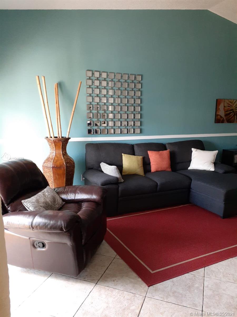 1404 Southwest 104th Court, Unit 89B Miami, FL 33174 - Photo 9 of 29 a living room with furniture