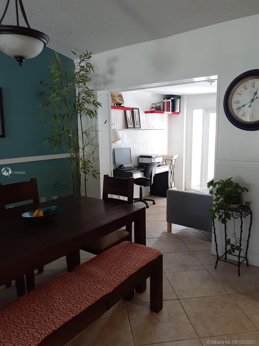 1404 Southwest 104th Court, Unit 89B Miami, FL 33174 - Photo 10 of 29 a room with furniture and window