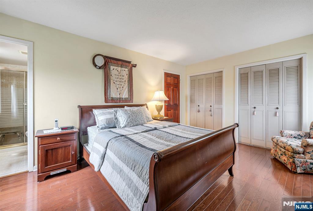 125 Prospect Avenue, Unit 16C Hackensack, NJ 07601 - Photo 24 of 35 a bedroom with a bed and a couch