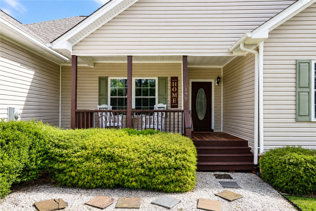 190 Fred Bradford Road Iva, SC 29655 - Photo 3 of 32 Welcoming front porch with ample space, perfect for enjoying peaceful outdoor moments.