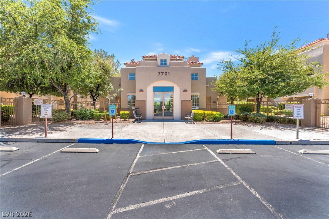 1901 Rio Canyon Court, Unit 102 Las Vegas, NV 89128 - Photo 22 of 23 A welcoming clubhouse with secure access and designated parking invites residents.