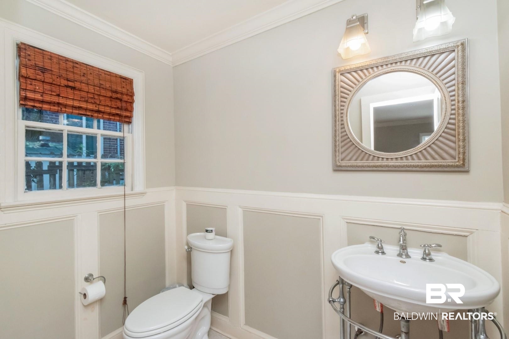 116 Florence Place Mobile, AL 36607 - Photo 17 of 41 Bathroom featuring sink, crown molding, and toilet