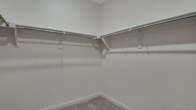 a view of an empty walk in closet