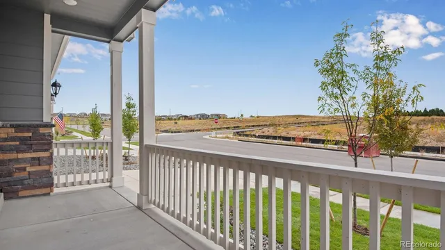 a view of a balcony with wooden floor