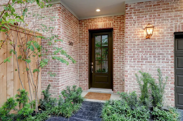 a view of front door of a house with a yard