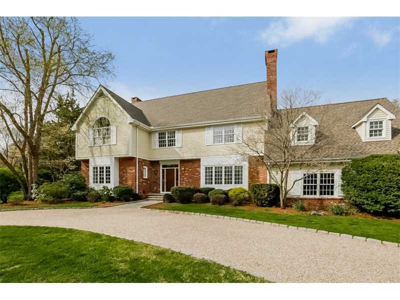 133 Stephen Mather Road Darien, CT 06820 - Photo 1 of 24 a front view of a house with a garden and plants