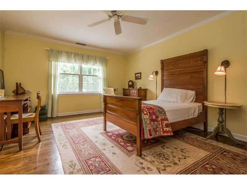 133 Stephen Mather Road Darien, CT 06820 - Photo 14 of 24 a bedroom with a bed and wooden floor