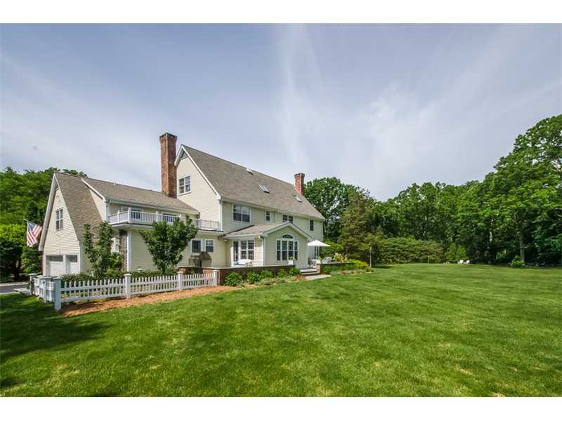 133 Stephen Mather Road Darien, CT 06820 - Photo 18 of 24 a view of a house with a big yard potted plants and large tree