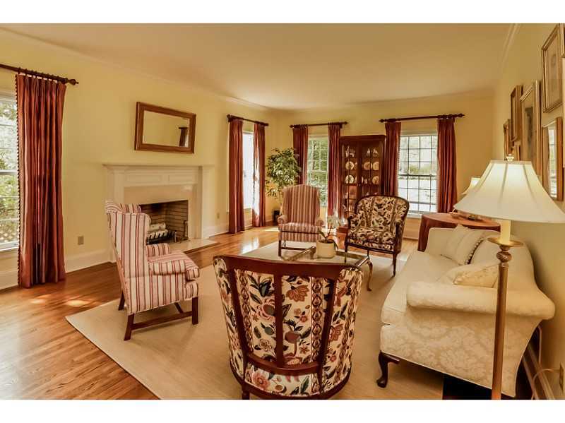 133 Stephen Mather Road Darien, CT 06820 - Photo 3 of 24 a living room with furniture a fireplace and a table