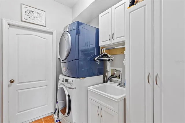 a bathroom with a granite countertop sink mirror and a bathtub