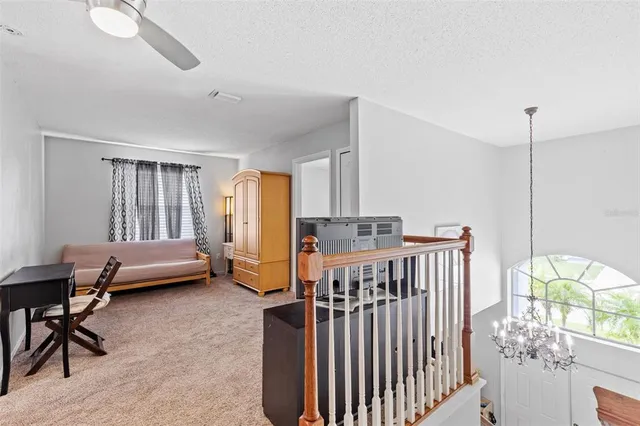 a white bath tub sitting in a bathroom next to a window