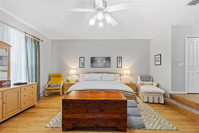 a bathroom with a sink tub shower and a mirror