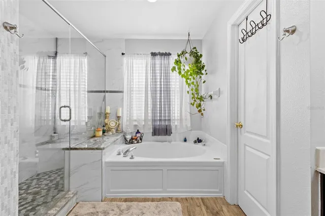 a bedroom with two beds and a chandelier