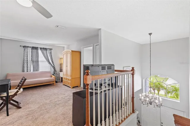 a bedroom with furniture and a window