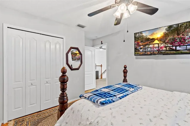 a dining room with furniture water view and a floor to ceiling window