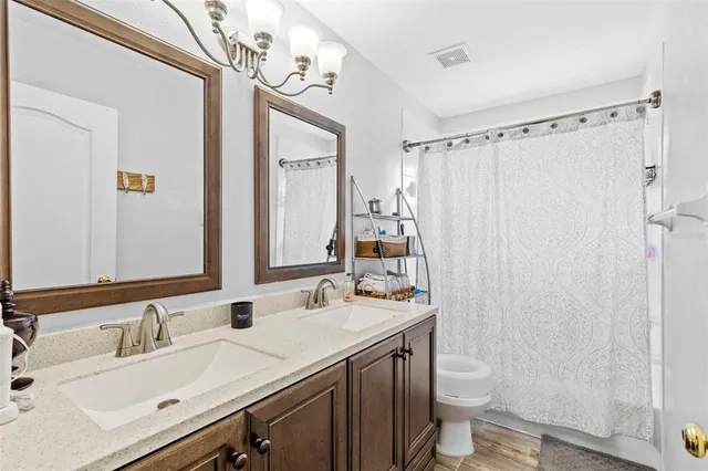 a view of a house with a backyard and a garden