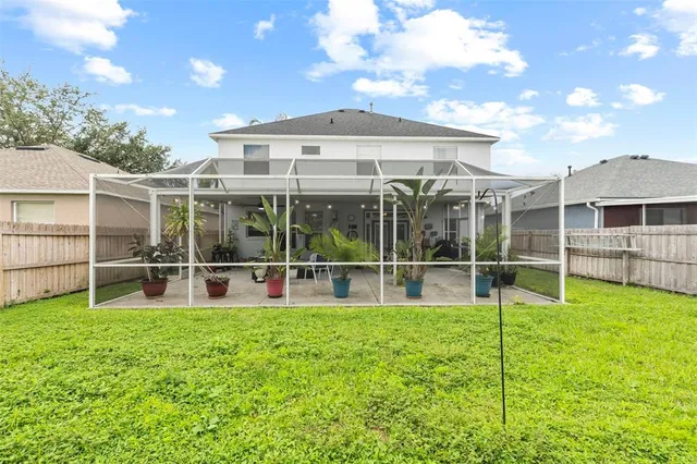 an aerial view of residential house with outdoor space and swimming pool
