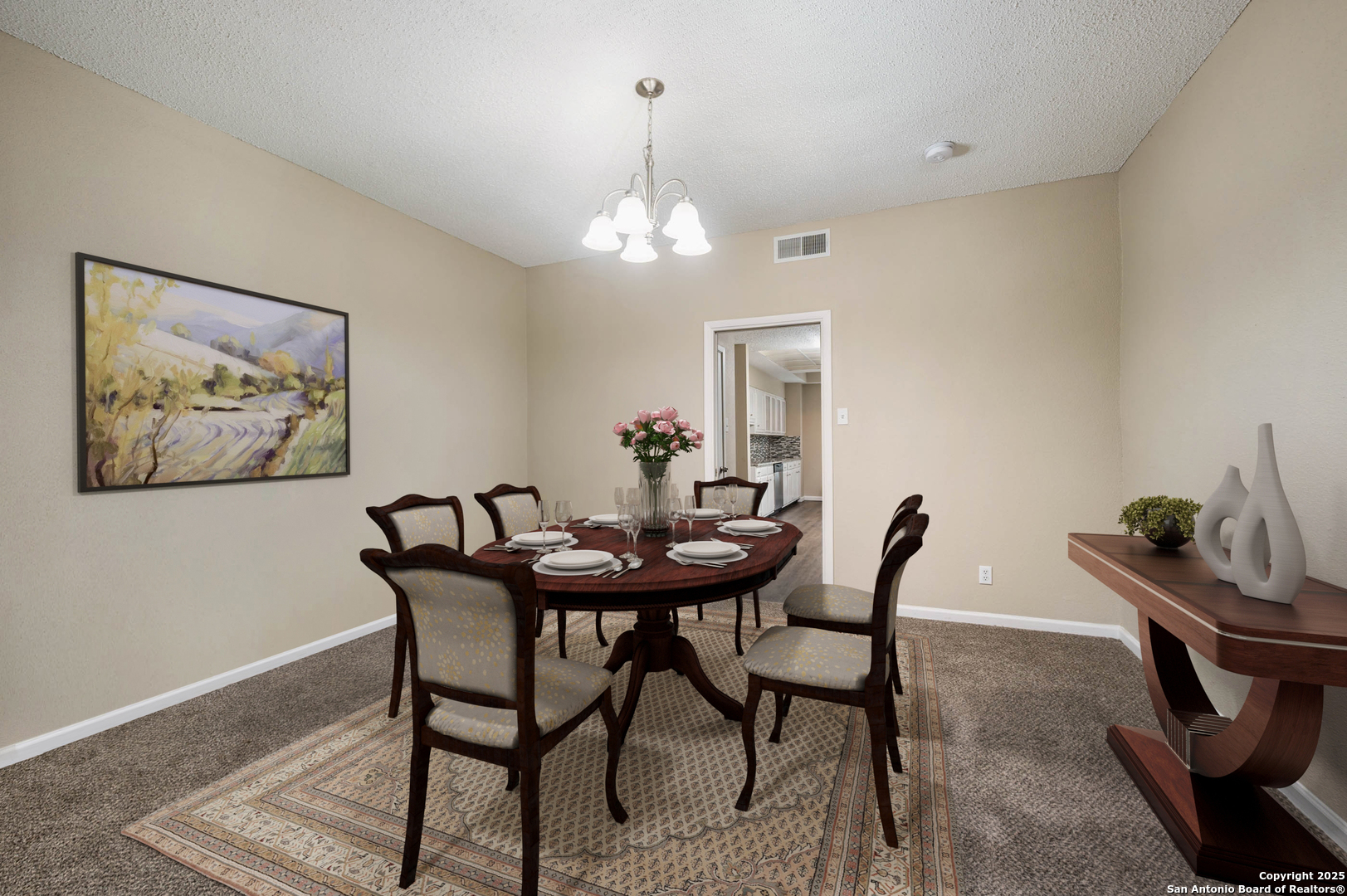 1819 Babcock Road, Unit 704 San Antonio, TX 78229 - Photo 6 of 28 a view of a dining room with furniture and chandelier