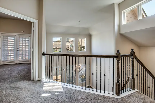 a view of a hallway with windows