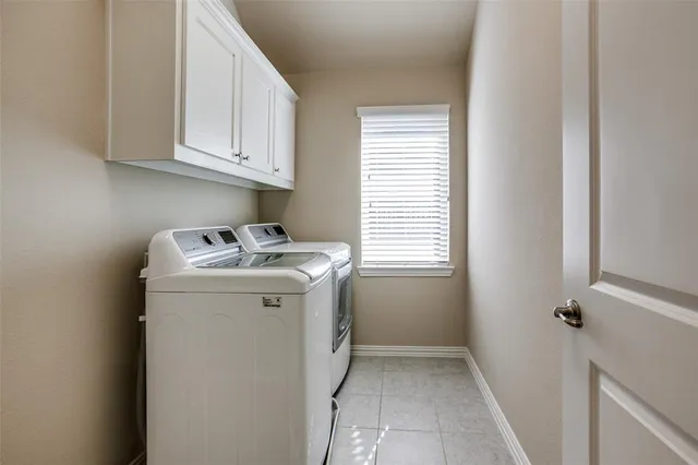 a utility room with closet dryer and washer