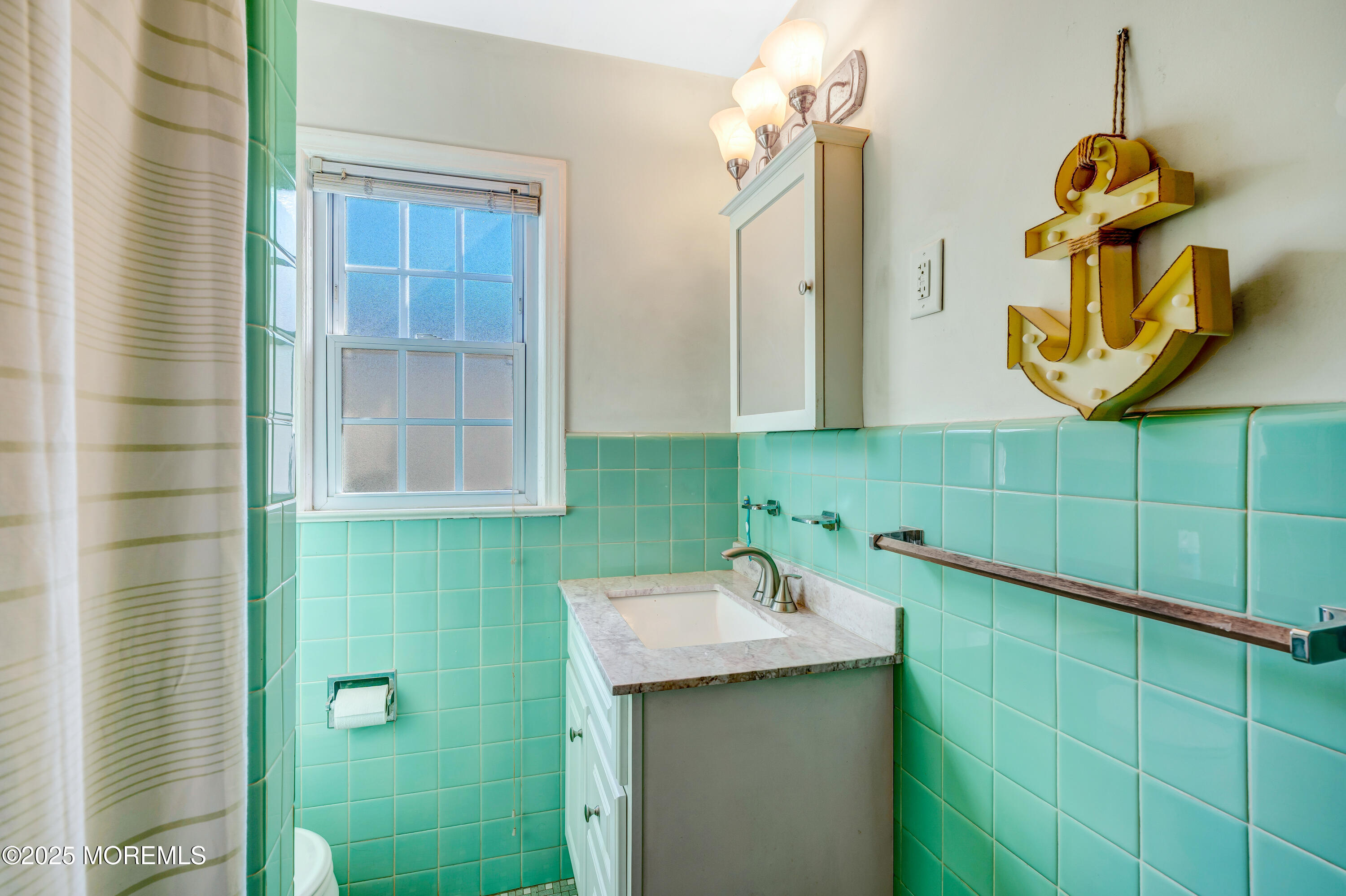 67 Victoria Place Red Bank, NJ 07701 - Photo 17 of 29 a bathroom with a sink and mirror