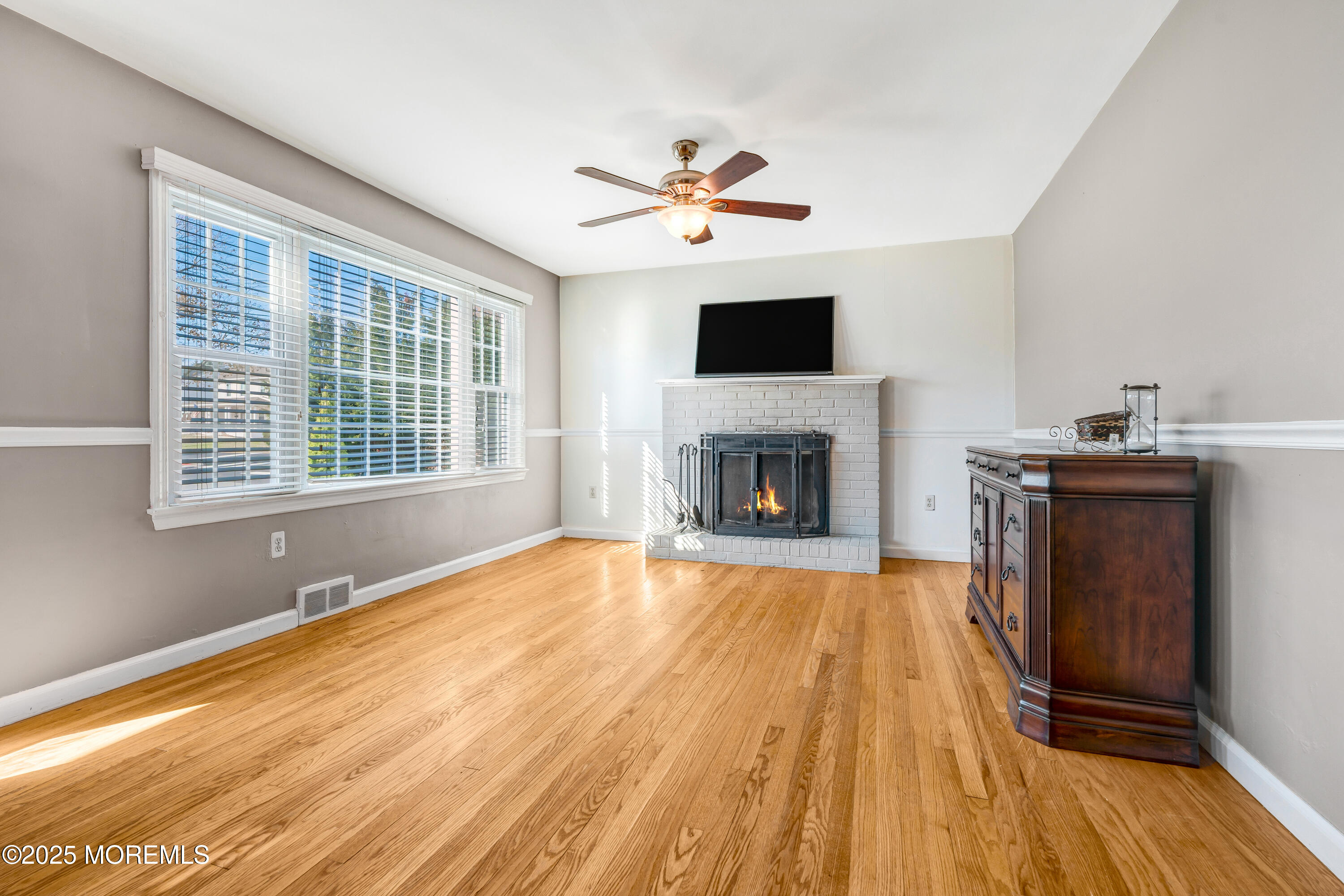 67 Victoria Place Red Bank, NJ 07701 - Photo 9 of 29 a view of empty room with wooden floor and fan