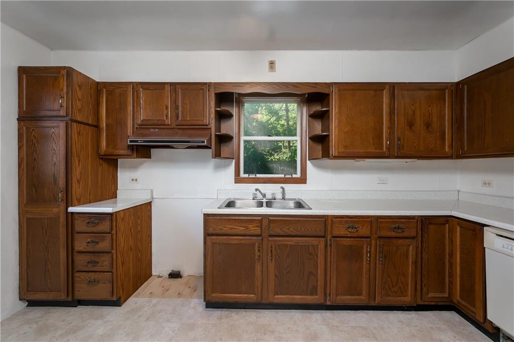 1438 Chicora Road Chicora, PA 16025 - Photo 17 of 25 a kitchen with stainless steel appliances granite countertop a refrigerator and a sink