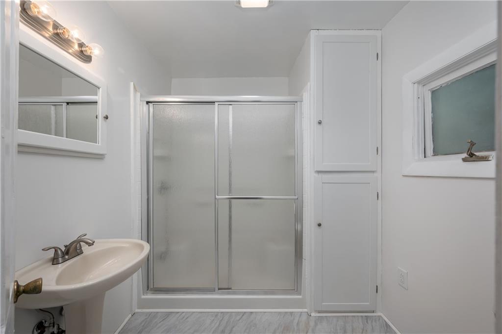 1438 Chicora Road Chicora, PA 16025 - Photo 22 of 25 a bathroom with a sink a toilet and shower