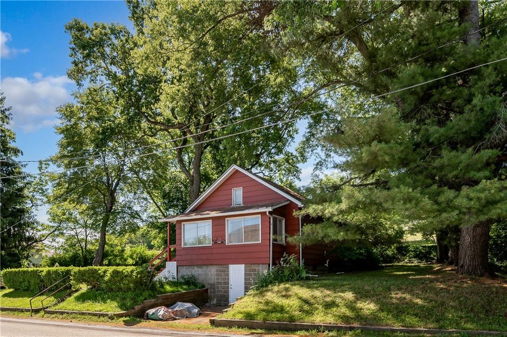 1438 Chicora Road Chicora, PA 16025 - Photo 24 of 25 a front view of a house with garden