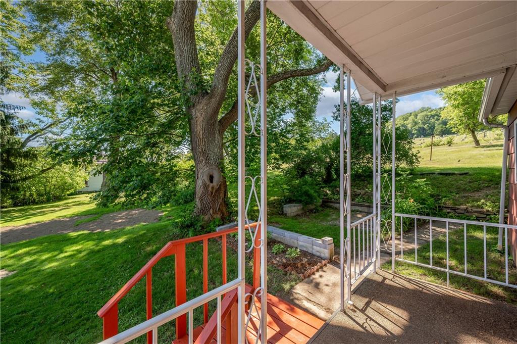 1438 Chicora Road Chicora, PA 16025 - Photo 6 of 25 a view of balcony with two trees and plants