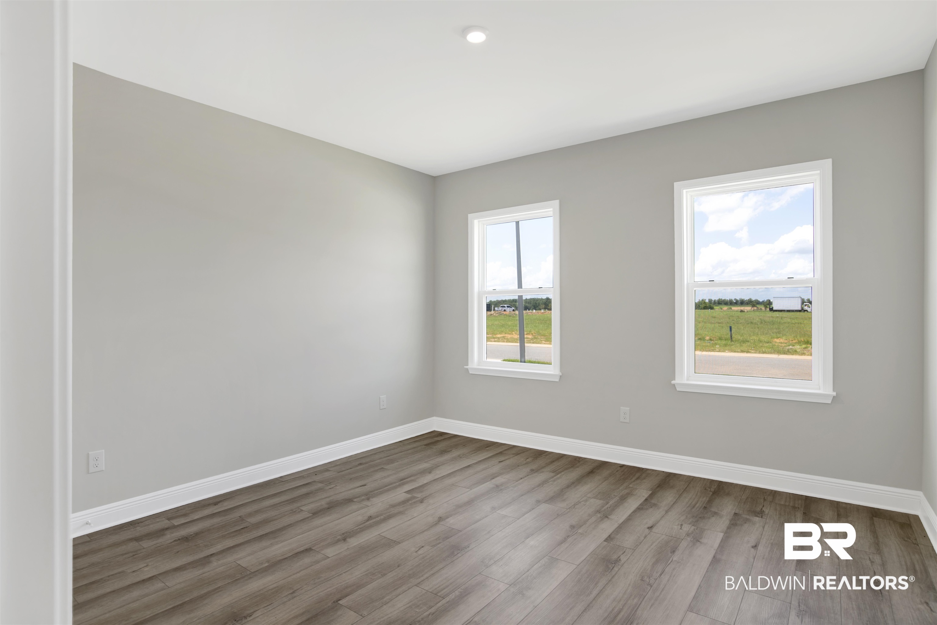23852 Lafite Circle Daphne, AL 36526 - Photo 16 of 30 Empty room with wood finished floors and baseboards