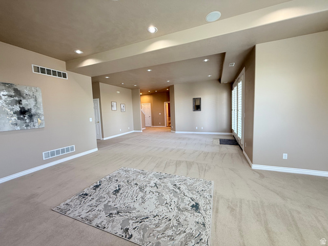 1562 Fairway Ridge Road Draper, UT 84020 - Photo 42 of 60 Spacious interior room with neutral-toned walls, recessed lighting, and light-colored carpet flooring