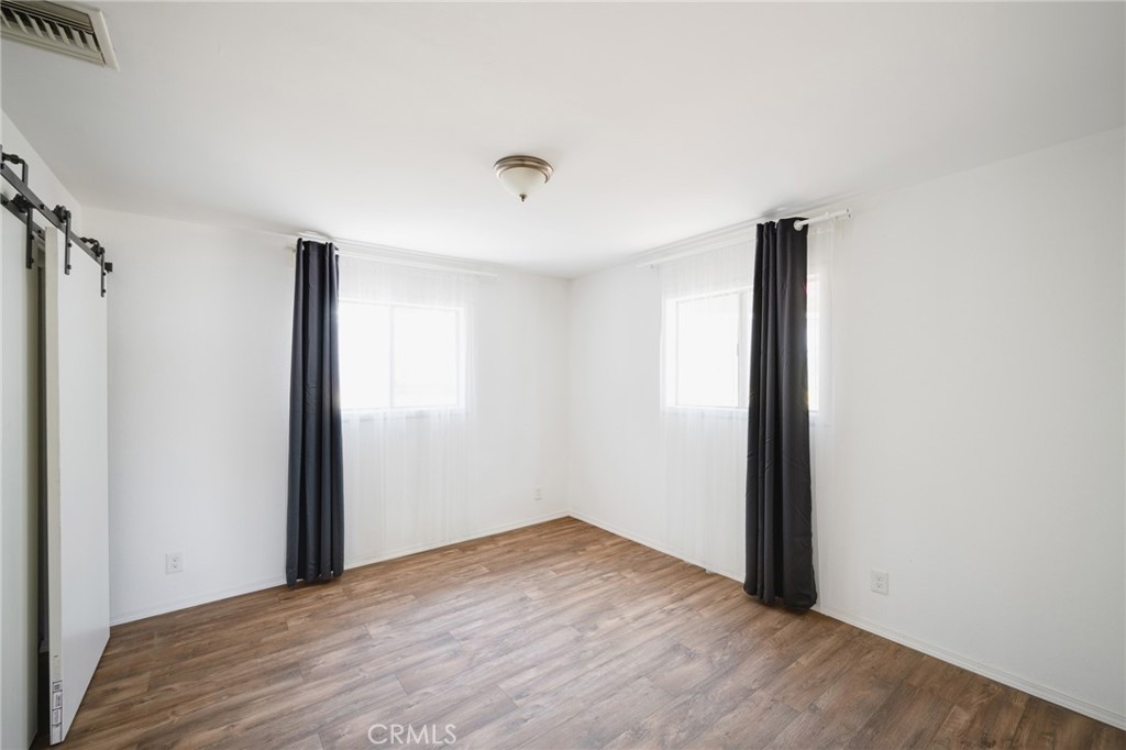 2254 Riverside Drive, Unit 2256 Los Angeles, CA 90039 - Photo 14 of 27 a view of an empty room with wooden floor