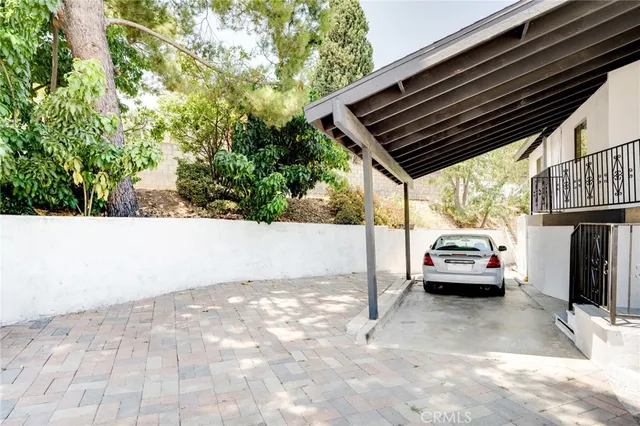 a view of garage with car parked