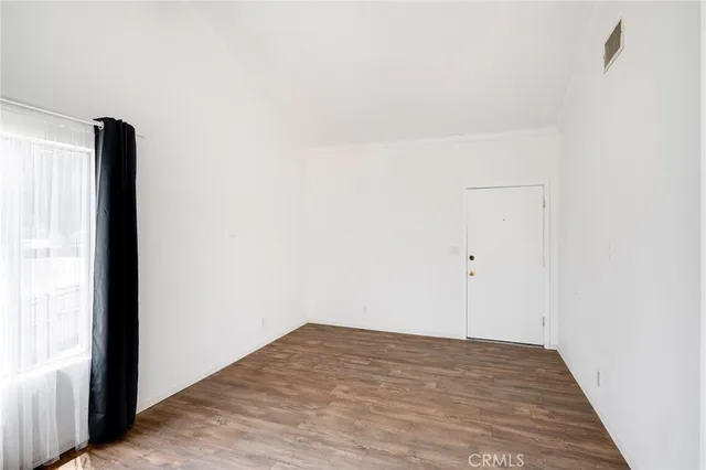 a view of a room that has a window in it