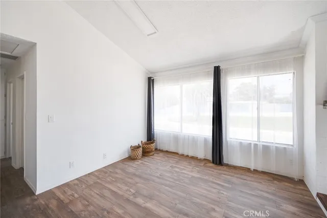 a view of an empty room and window