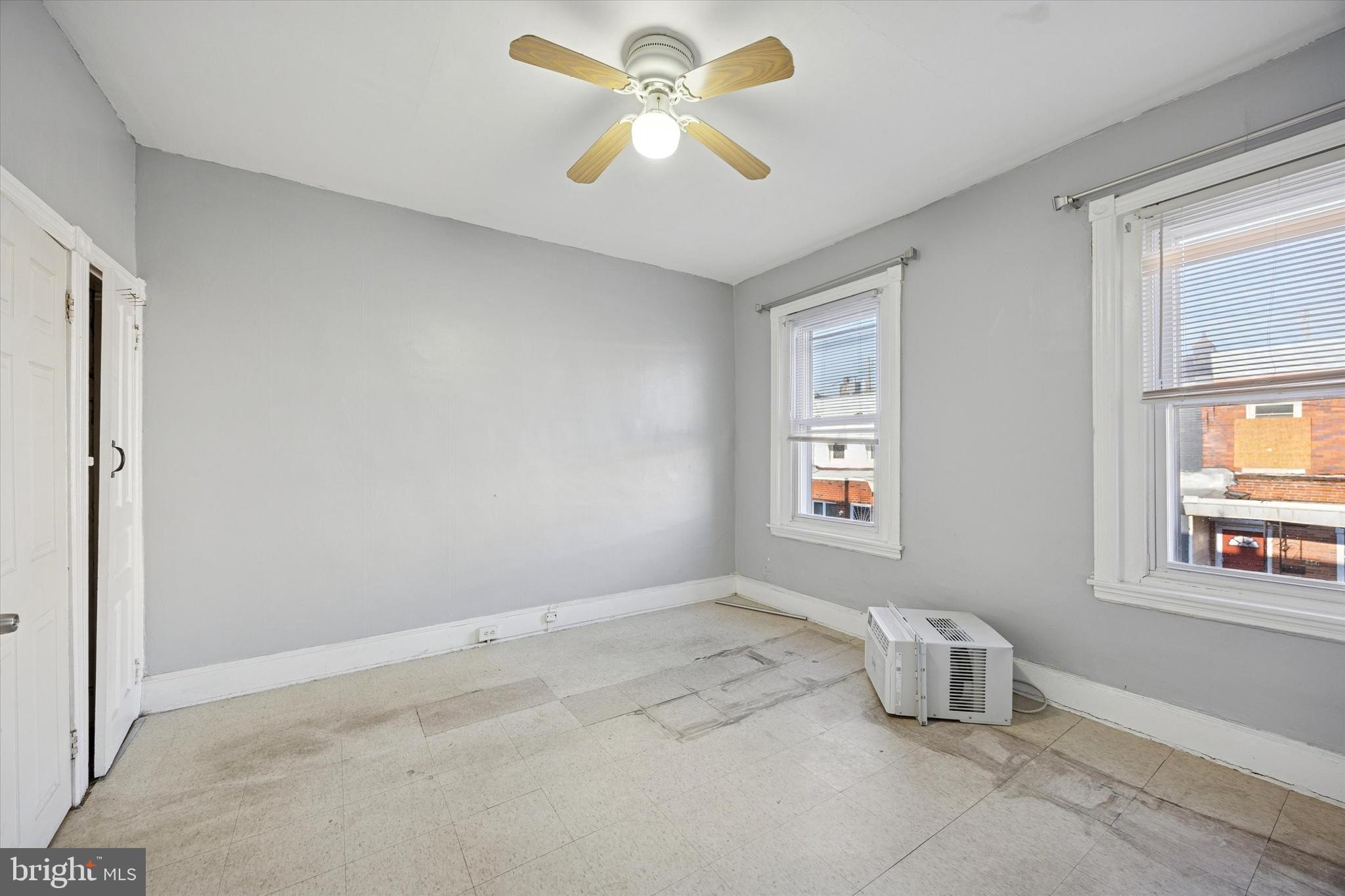 6340 Theodore Street Philadelphia, PA 19142 - Photo 14 of 15 a view of room with windows and ceiling fan