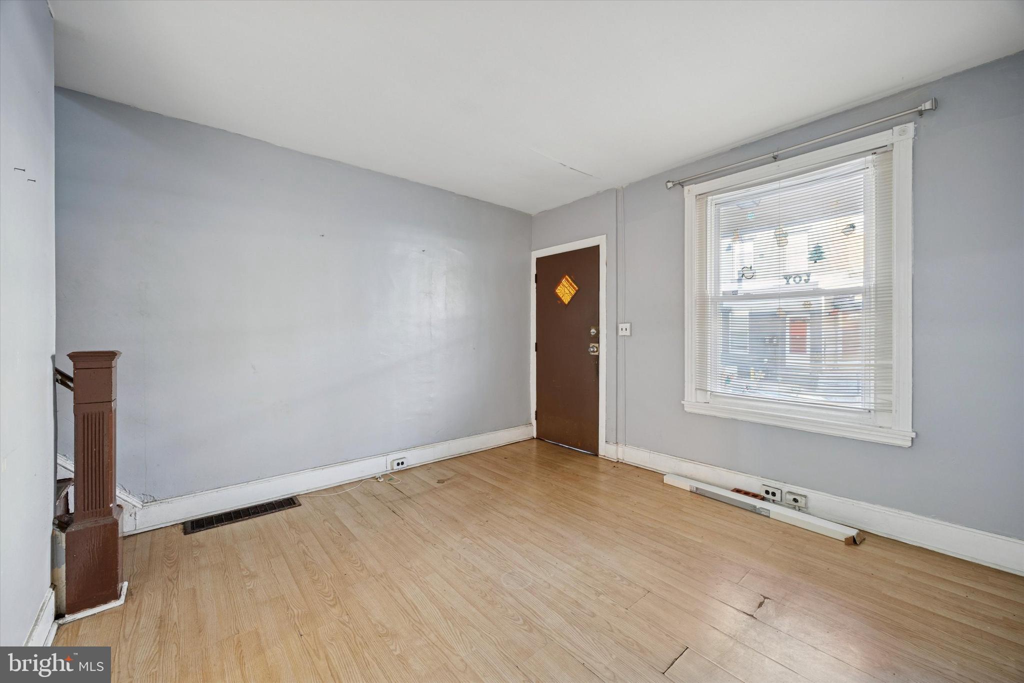 6340 Theodore Street Philadelphia, PA 19142 - Photo 5 of 15 wooden floor in an empty room with a window