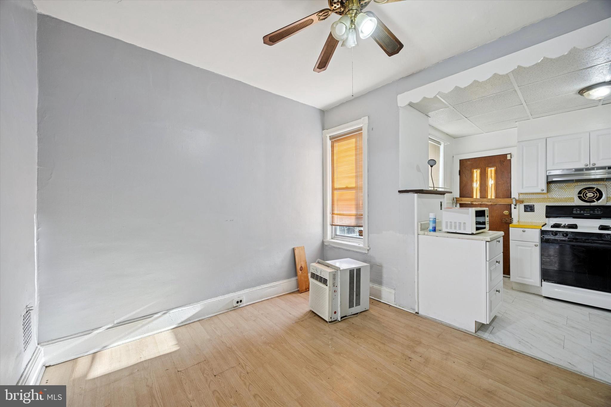6340 Theodore Street Philadelphia, PA 19142 - Photo 6 of 15 a kitchen with stainless steel appliances a refrigerator and a sink
