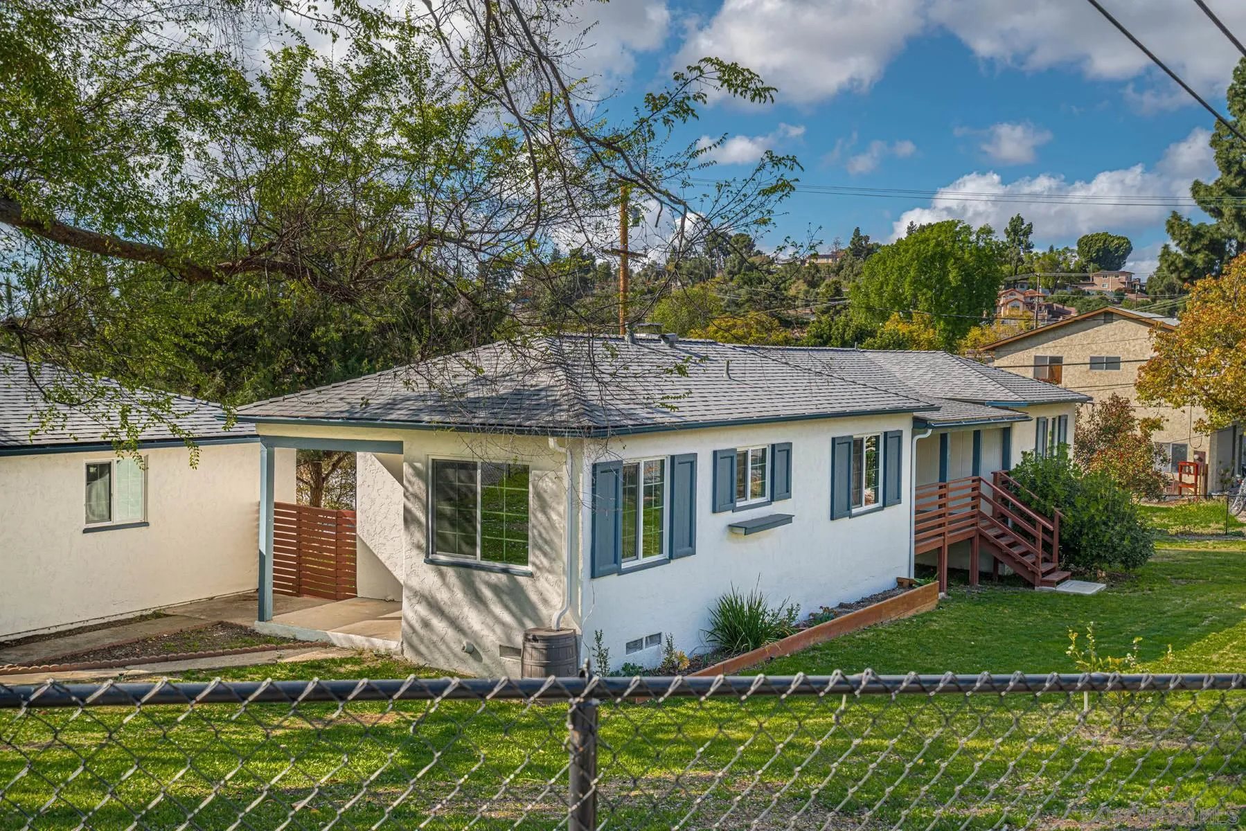 10540 Don Pico Road Spring Valley, CA 91978 - Photo 42 of 43 a view of house with a yard and potted plants