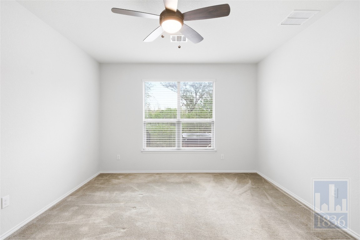 8005 Crystalbrook West Austin, TX 78724 - Photo 18 of 37 an empty room with a window and a fan