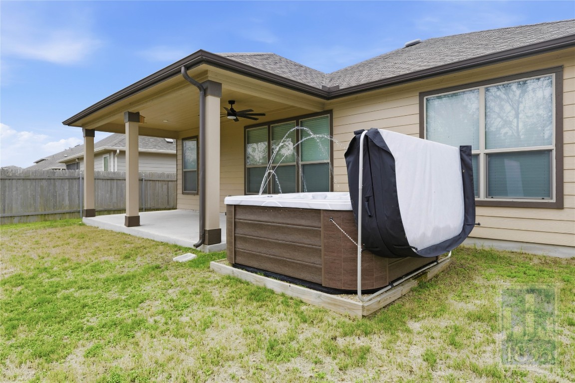8005 Crystalbrook West Austin, TX 78724 - Photo 36 of 37 a view of a backyard with a tub and wooden fence