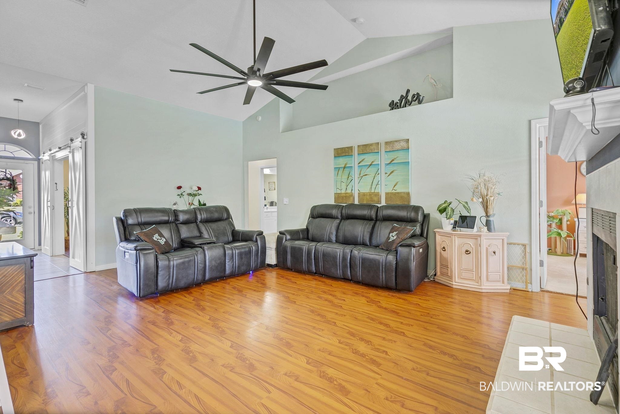 16358 Tempest Drive Foley, AL 36535 - Photo 8 of 46 Living area with a fireplace, light wood-style floors, a ceiling fan, and high vaulted ceiling