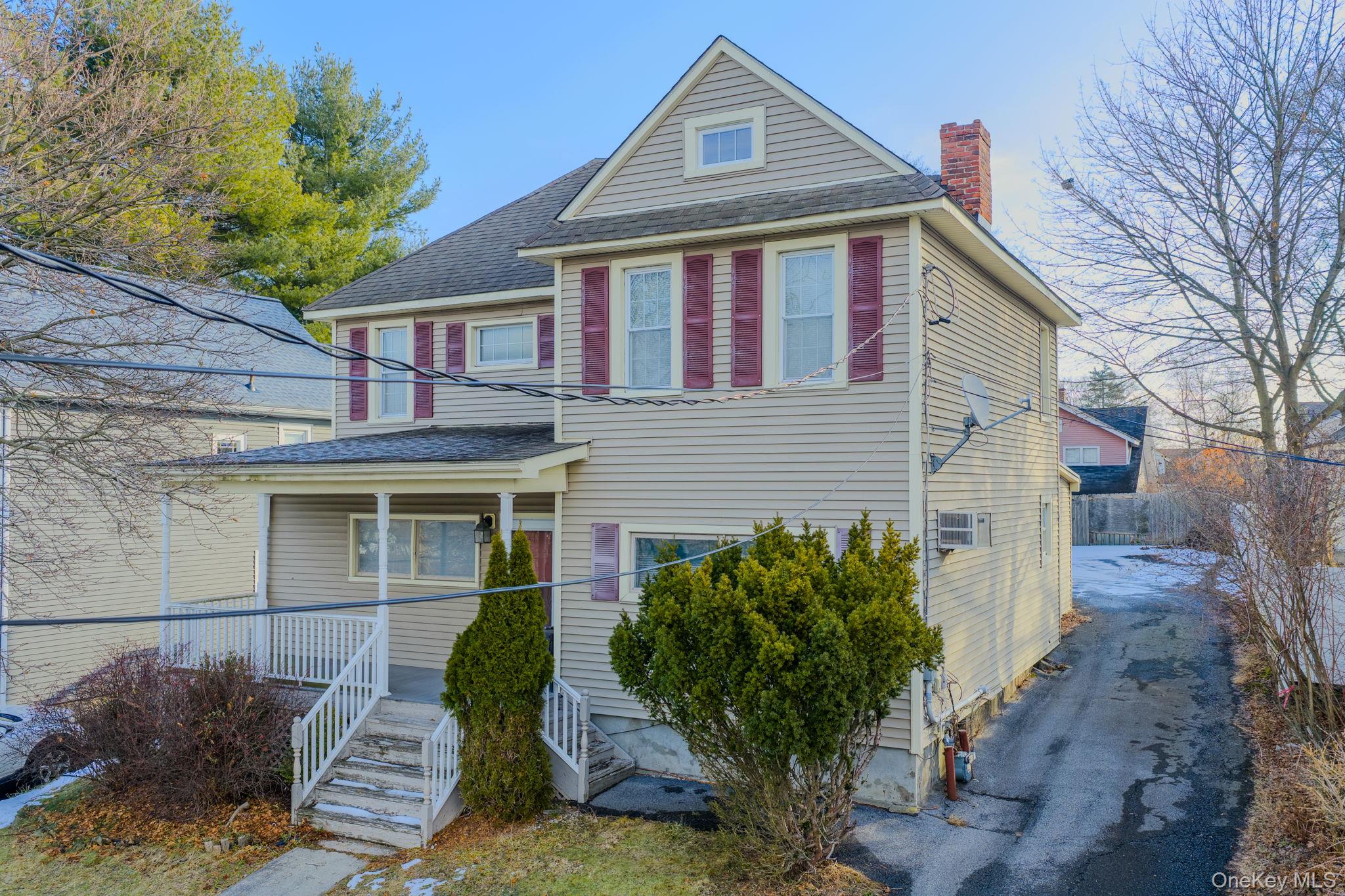 21 Ridge Street Middletown, NY 10940 - Photo 2 of 32 View of front facade with a chimney, roof with shingles, and covered porch
