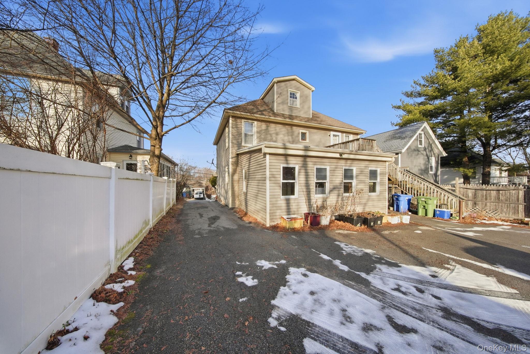 21 Ridge Street Middletown, NY 10940 - Photo 29 of 32 Rear view of house featuring stairway