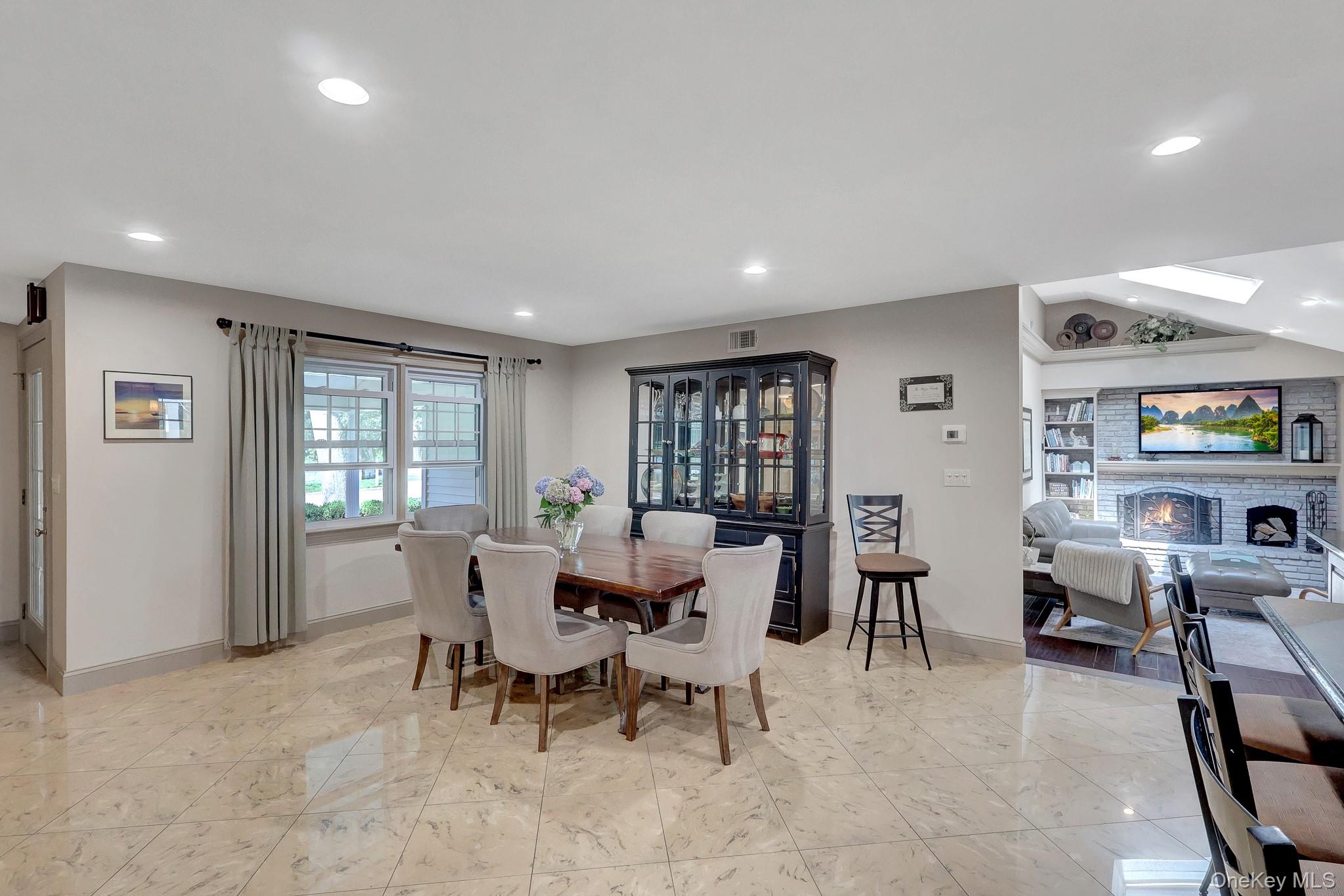 24 Fox Road East Setauket, NY 11733 - Photo 8 of 48 Open-concept dining area featuring ceramic square tile flooring (radiant heat) and recessed lighting