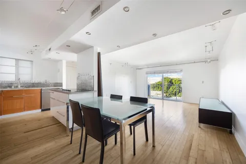 a kitchen with a table and chairs in it