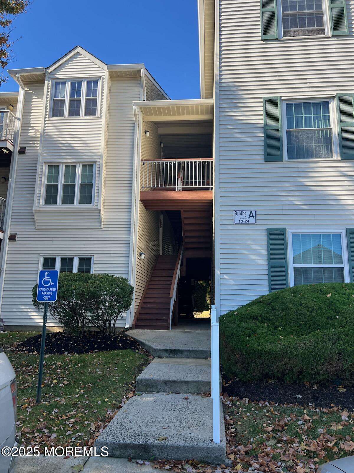 231 Atlantic Street, Unit 23 Keyport, NJ 07735 - Photo 1 of 1 a front view of a house with garden