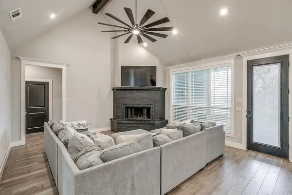 a living room with furniture and a fireplace