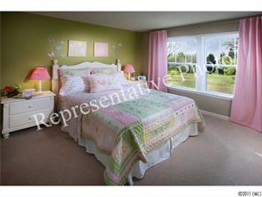 7008 Meyer Road Fort Mill, SC 29715 - Photo 5 of 6 a bedroom with a bed and a window